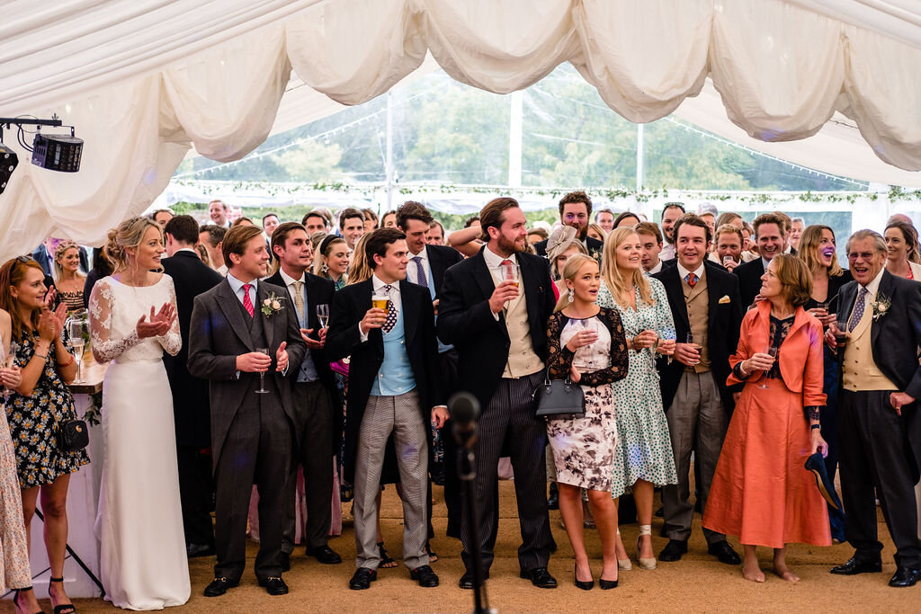 wedding speeches in marquee audience listening