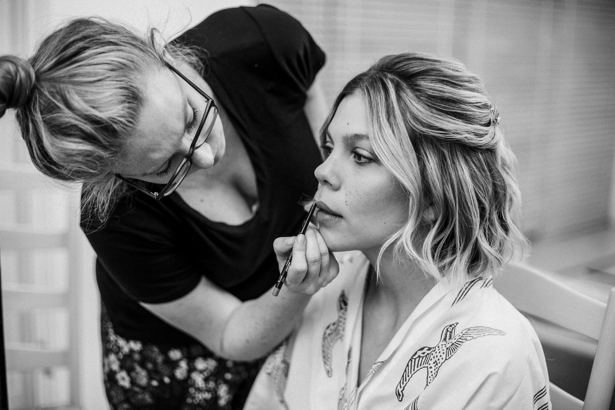 close up of bride having her make up done for wedding in Fulham Palace