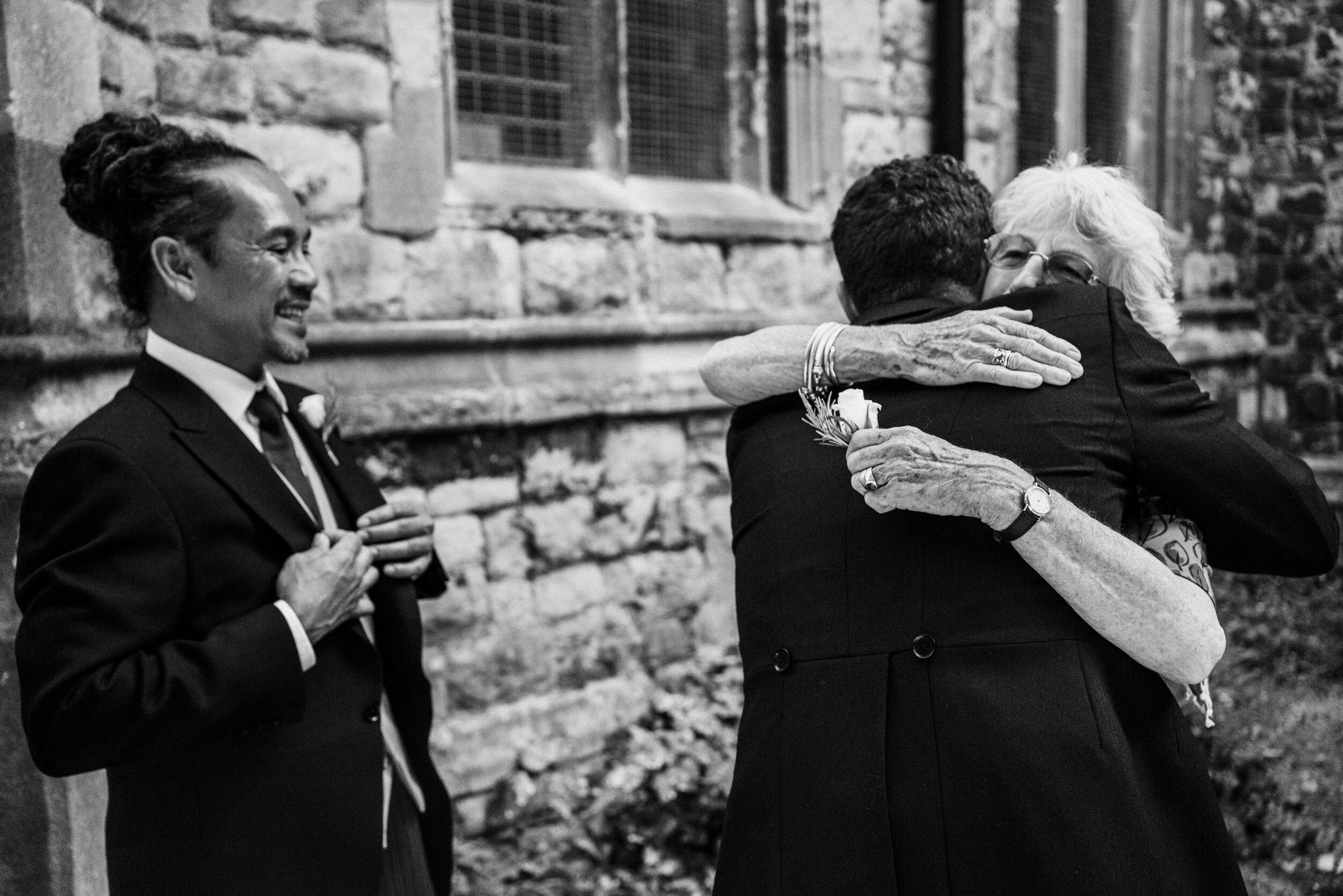 people hugging at wedding at Fulham Palace