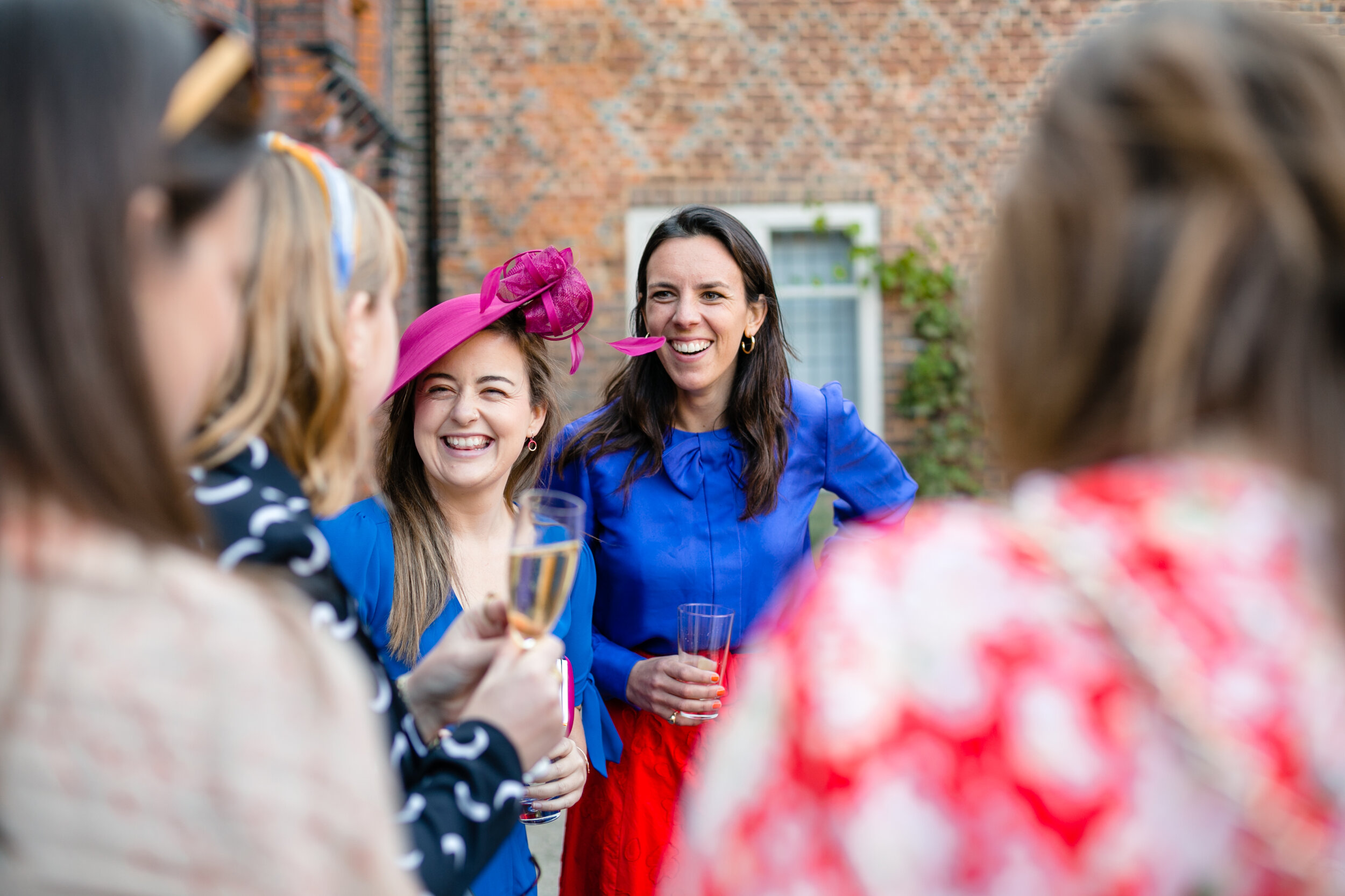 laughing wedding guests photo Fulham Palace