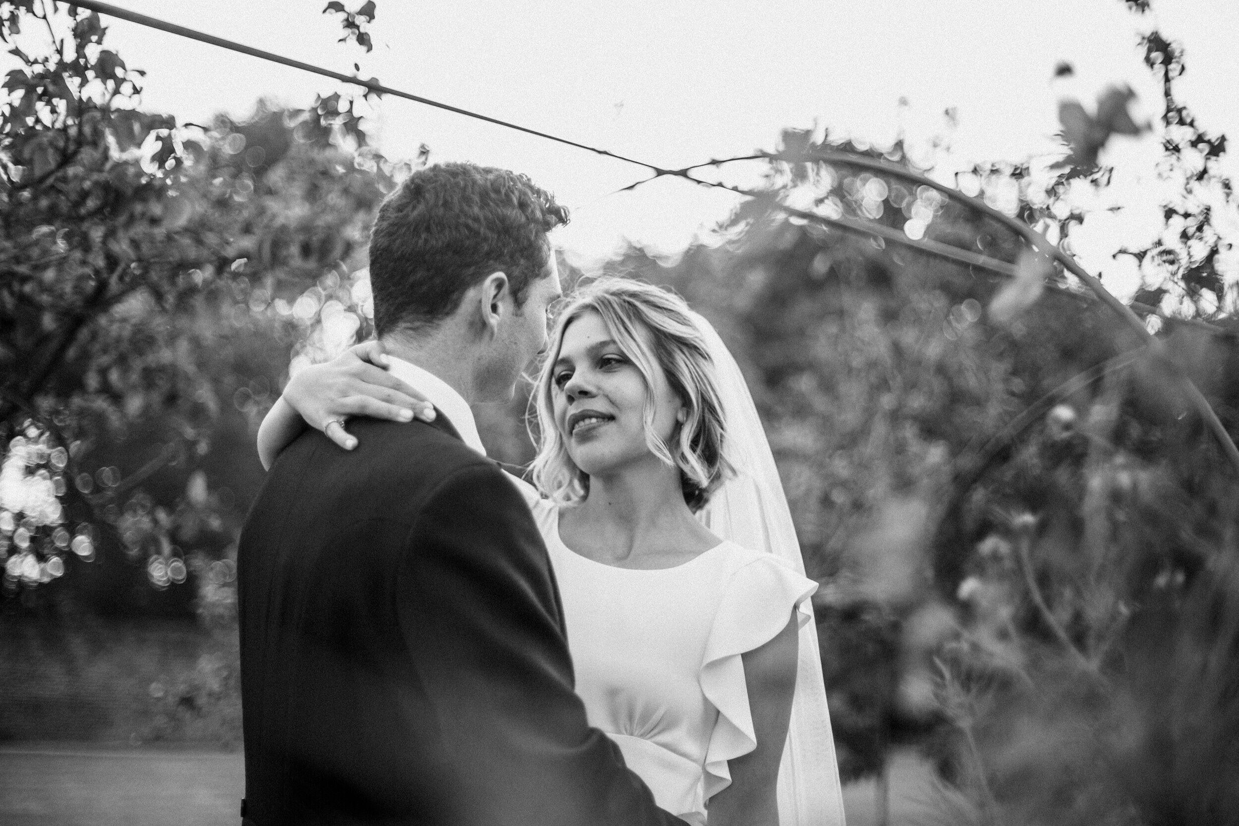 couple shot sunset Fulham Palace wedding in walled garden