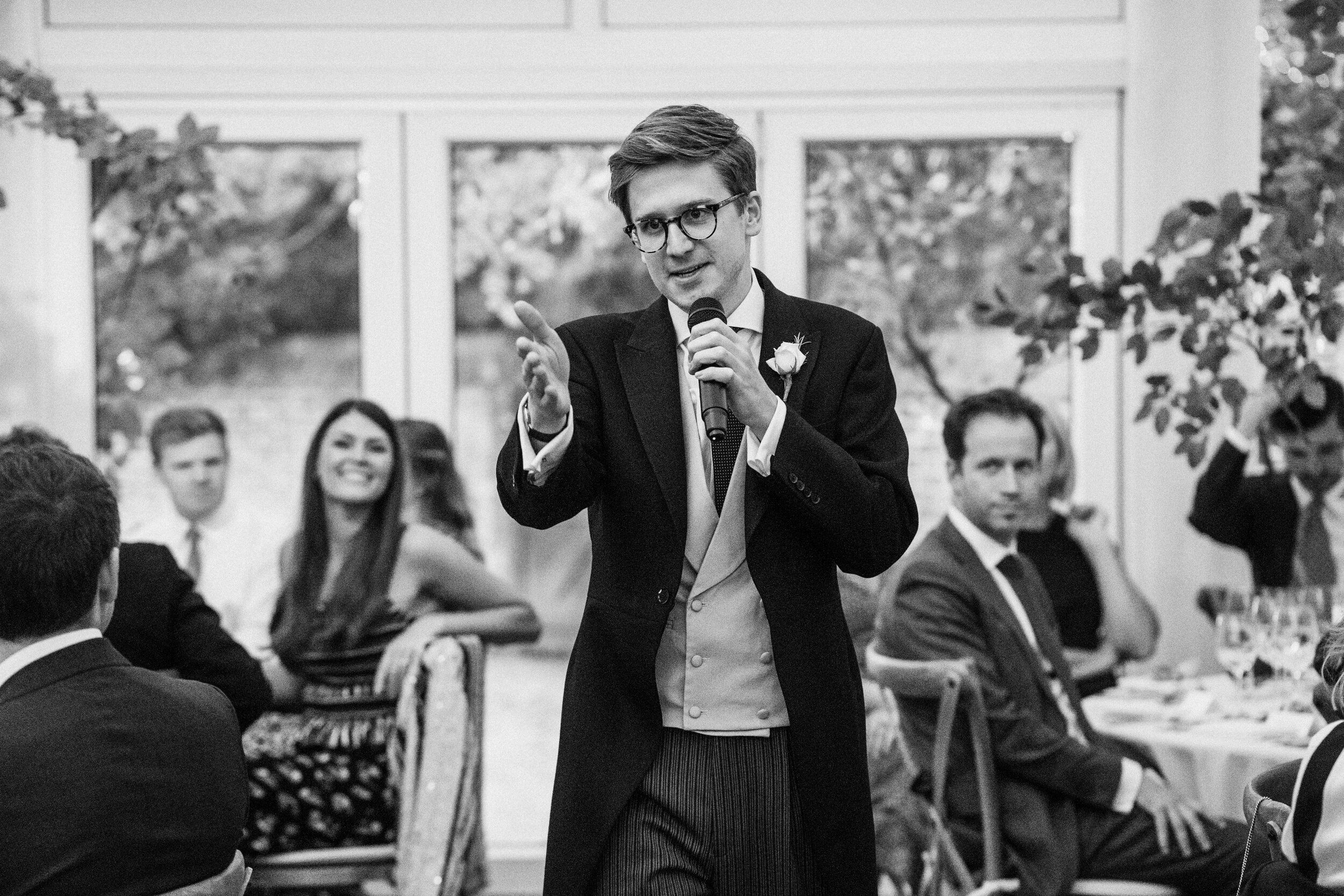 best man giving speech at wedding reception