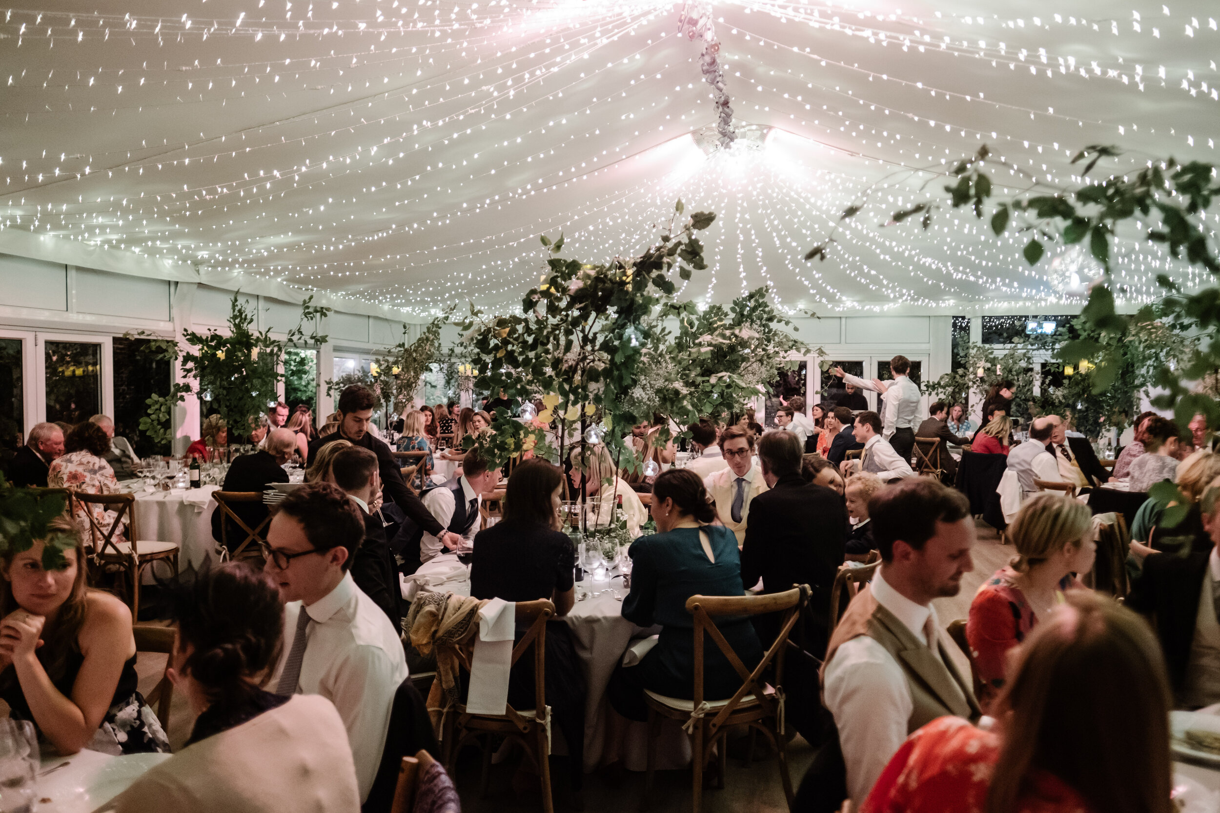 photo of inside of wedding marquee at Fulham Palace during nighttime