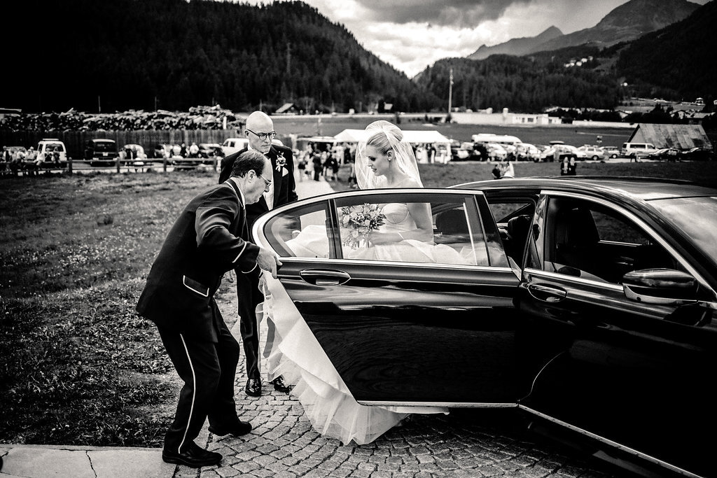 black and white bride getting out of car before wedding picture