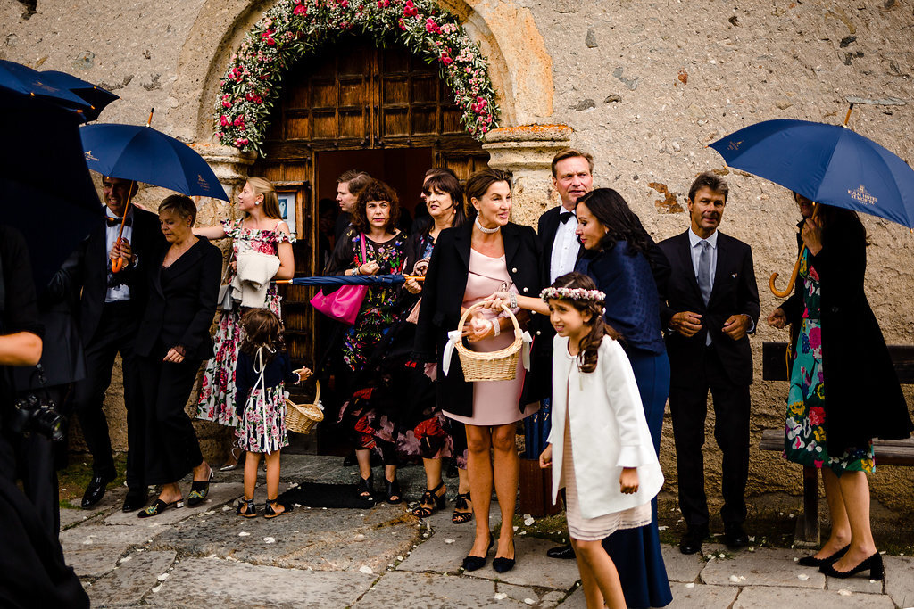 rain umbrella guests outside church