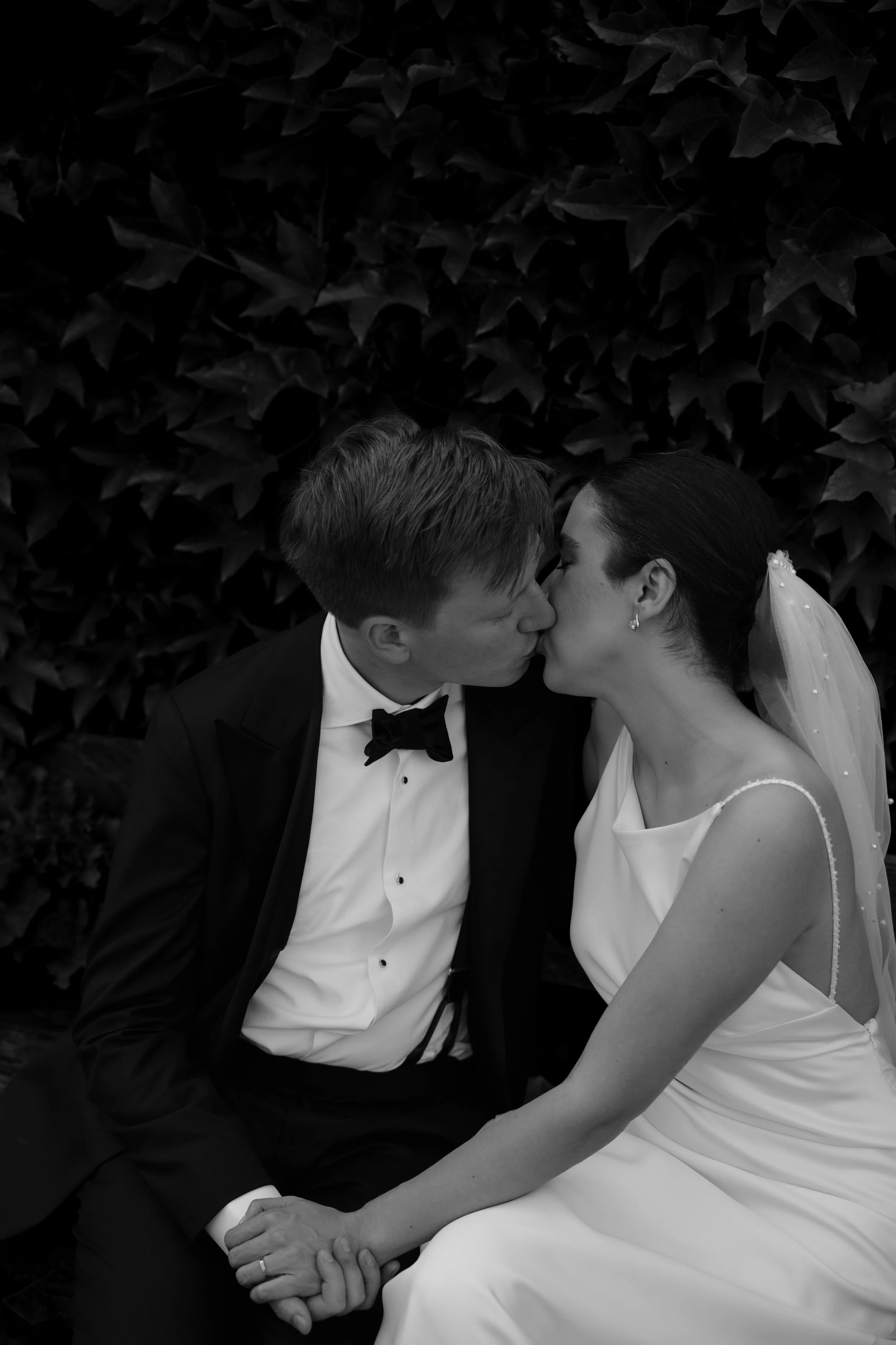 Groom embracing the bride in a quiet moment on a London street.