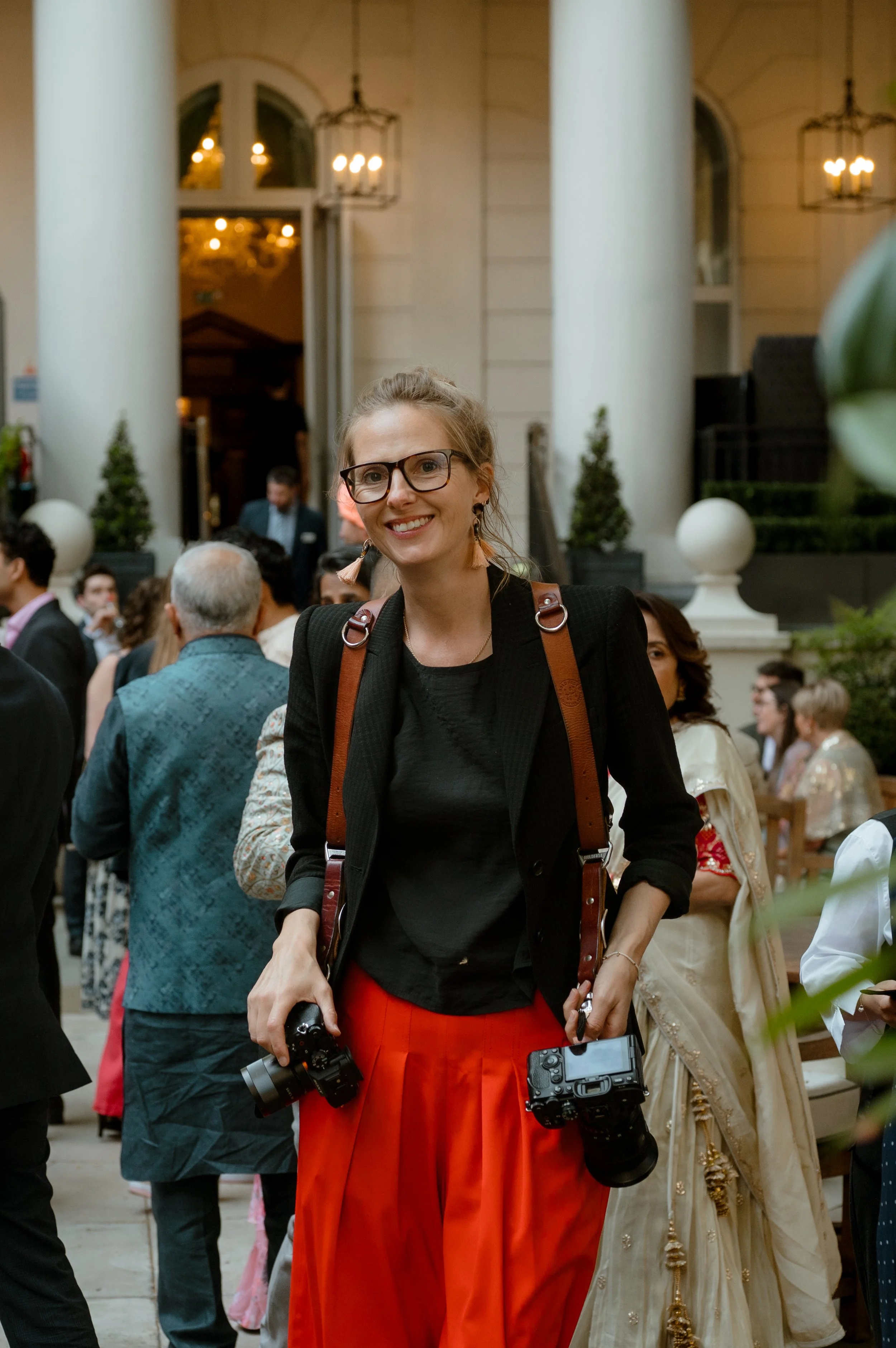 London wedding photographer Helen Abraham photographing guests during a celebration.