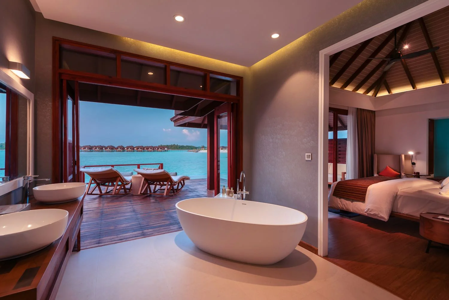 maldives-varu-by-atmosphere-water-villa-with-pool-villa-cross-section-at-dusk-holiday-honeymoon-vacation-invite-to-paradise.jpg