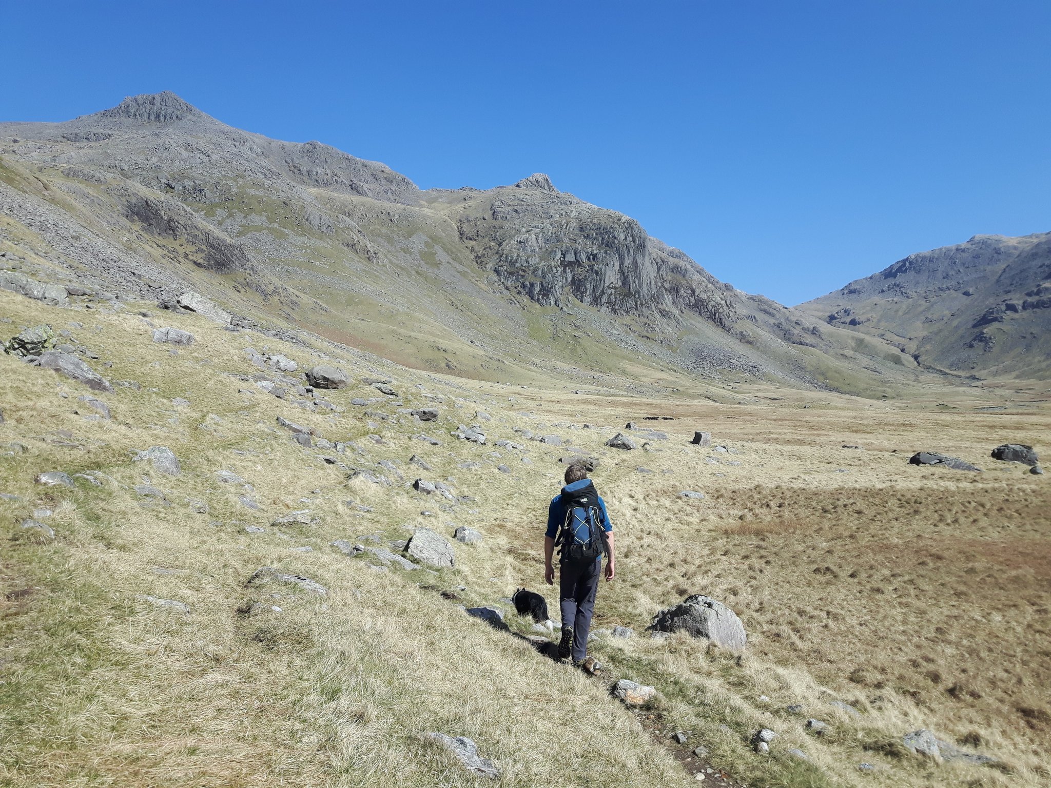 Chris Moore and Pippa walking in to Esk Buttress