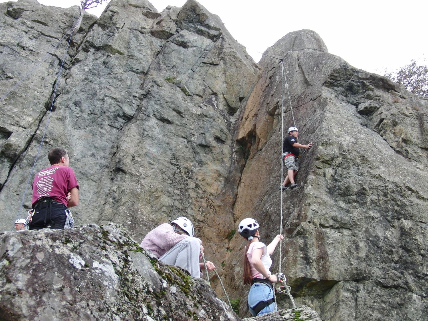  Clients climbing a belaying on a single pitch crag in the Lake District - Chris Ensoll Mountain Guide 