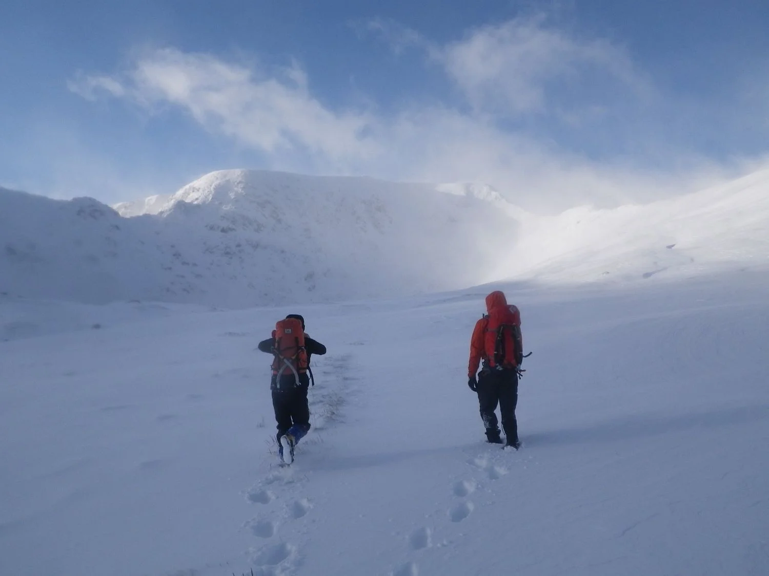 Clients walking in the winter mountains in the Lake District - Chris Ensoll Mountain Guide