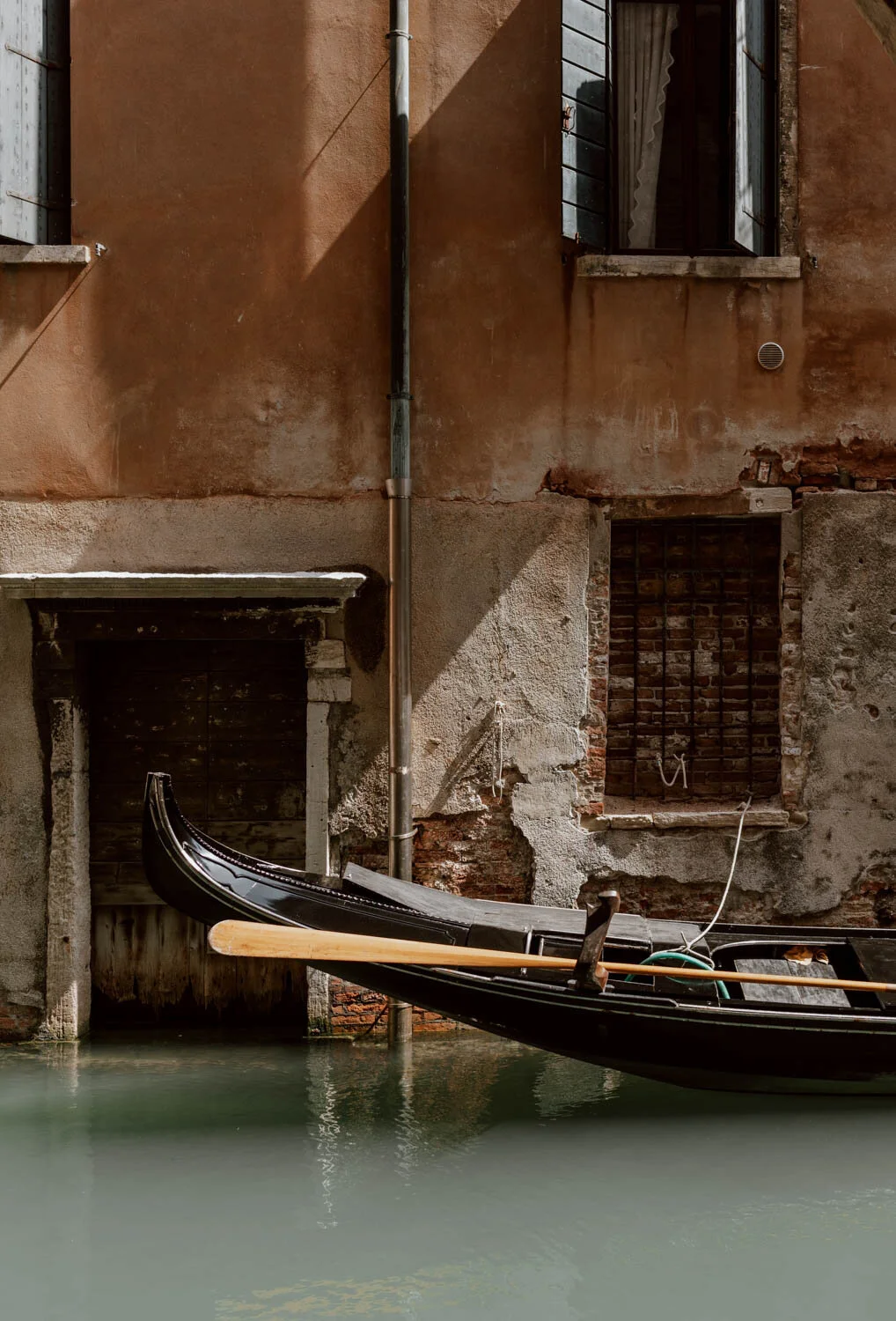 Gondola in a canal in Venice