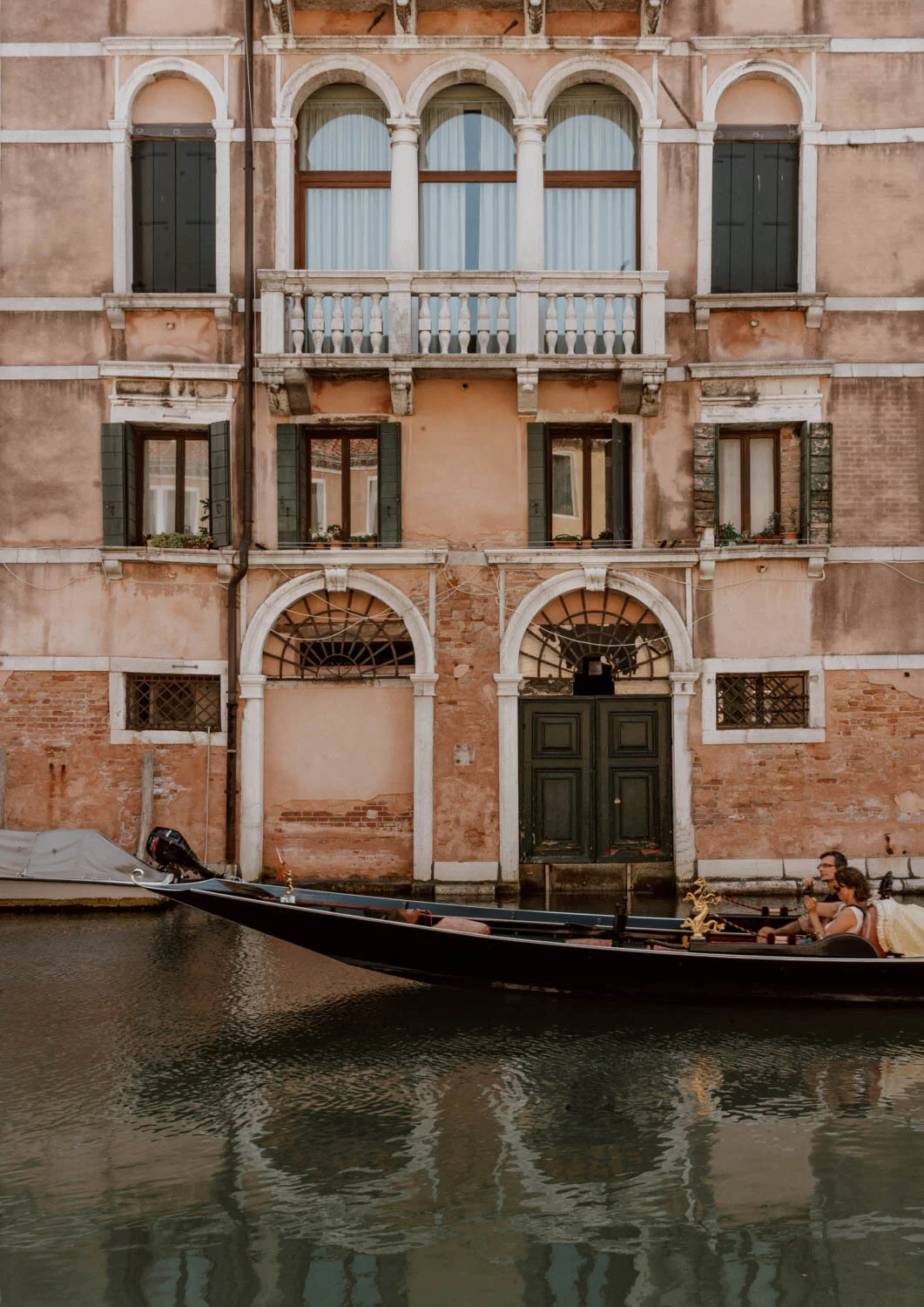 Watching gondolas going by in Venice