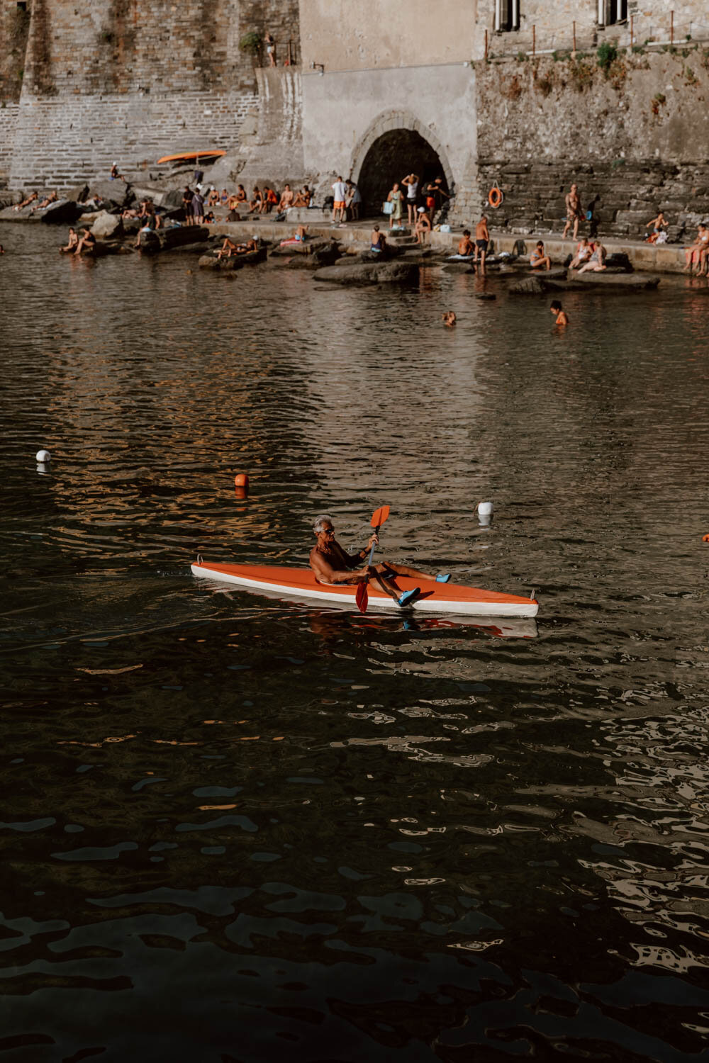 Man kayaking in Vernazza harbour