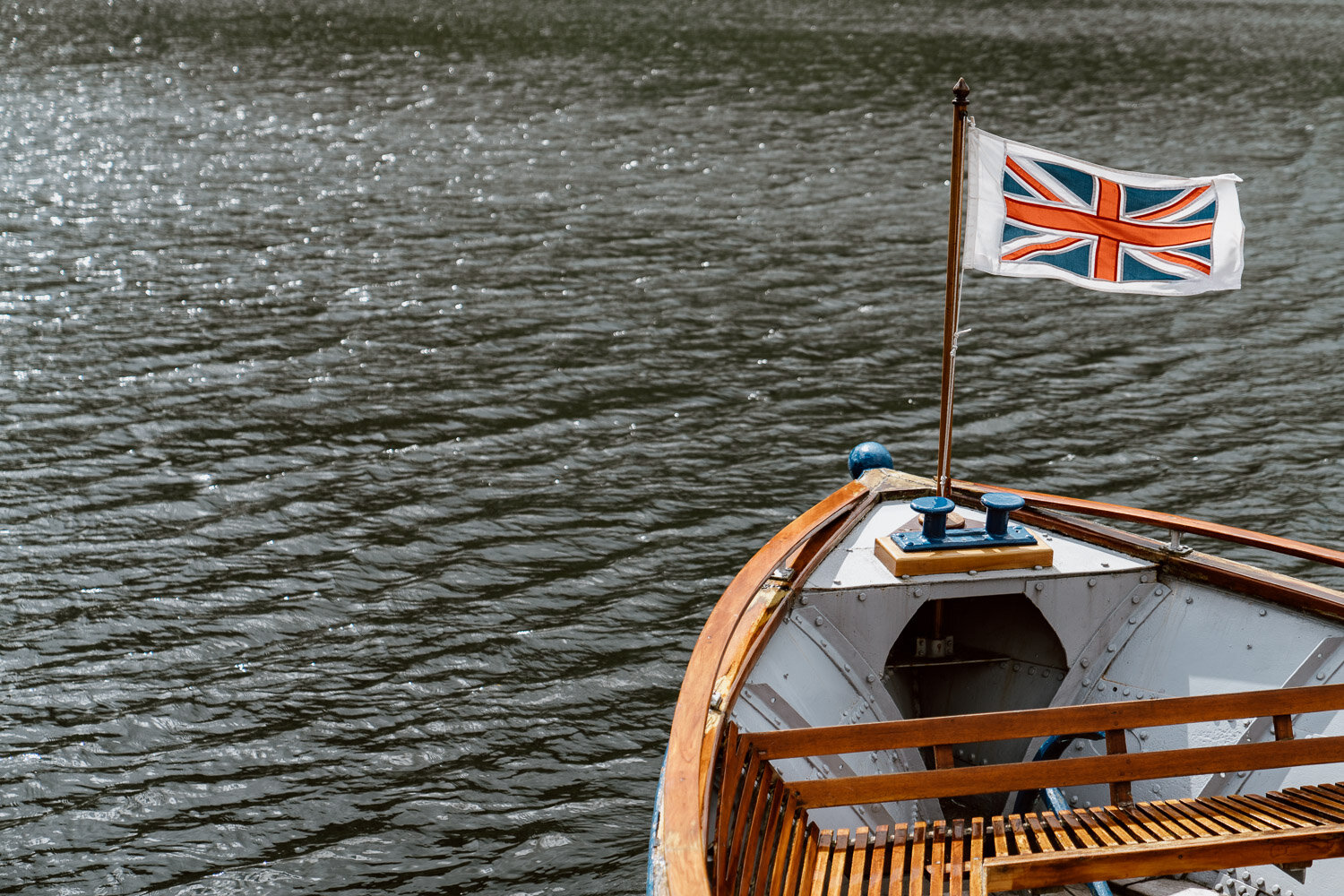 wooden boat with union jack flag