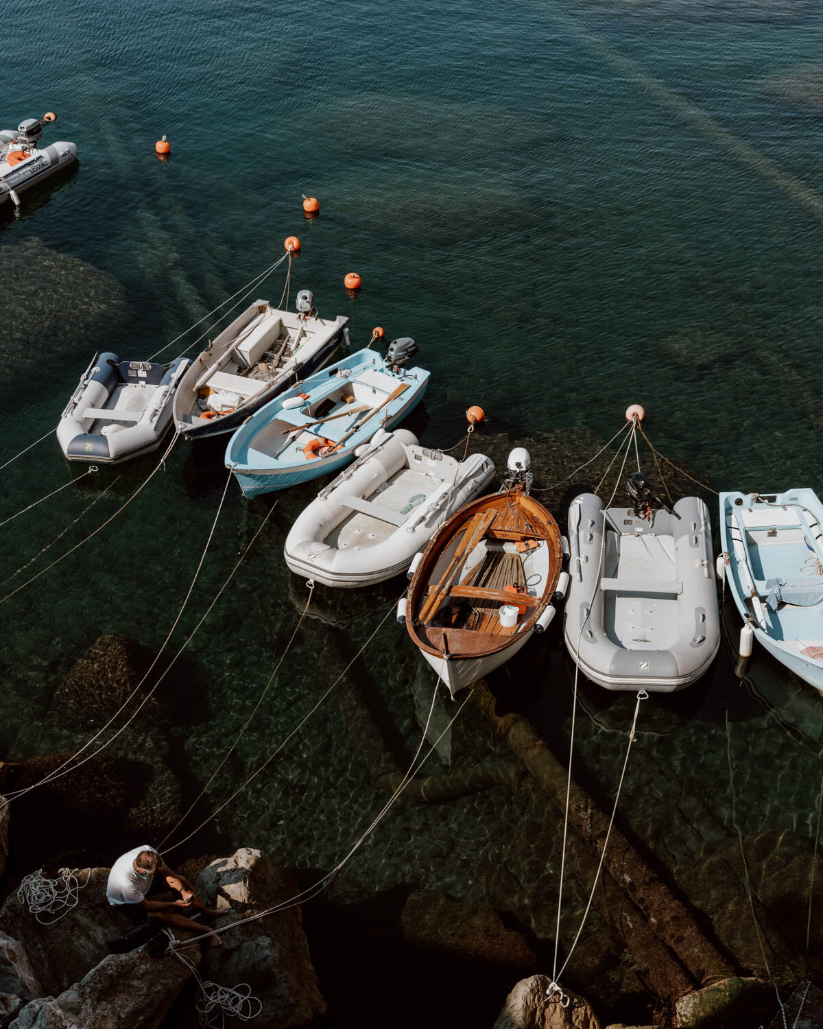 small boats tethered in harbour