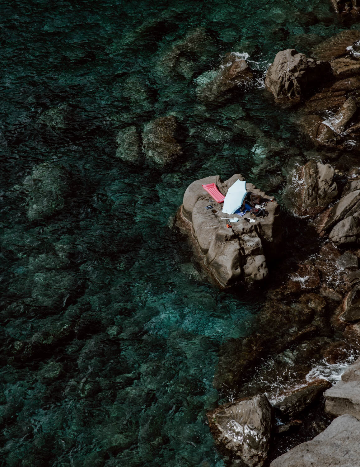 Corniglia swimming spot with parasol and lilo