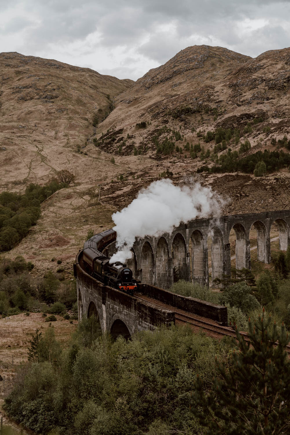 glenfinnan viaduct with train passing over