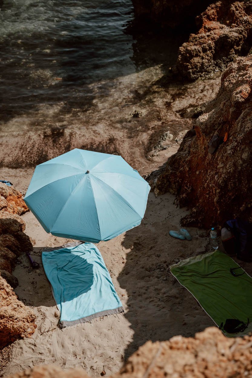 best-beaches-in-menorca-blue-parasol