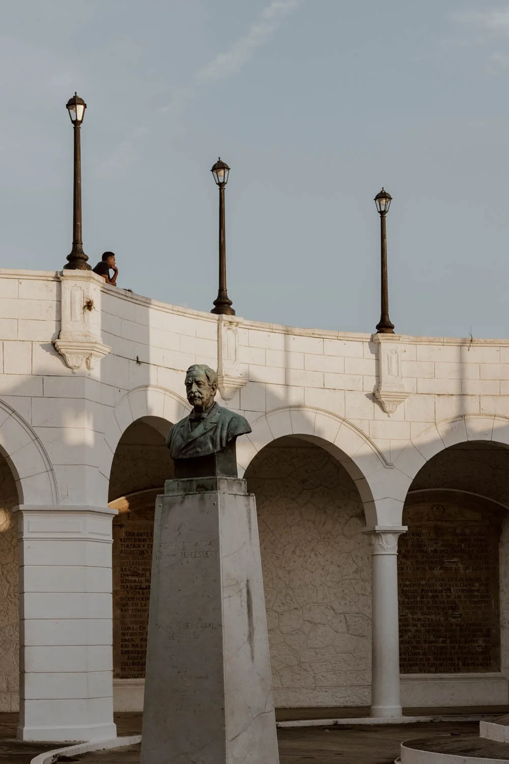Paseo Las Bovedas at golden hour, with young Panamanian boy looking out