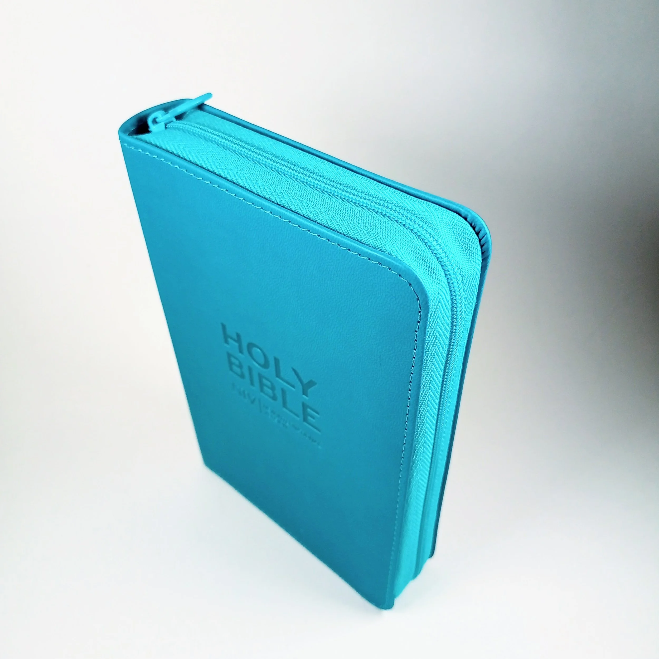 NIV Cyan Pocket, Bible, Imitation Leather, Shortcuts to key stories, Reading plans, Book overview, Orange ribbon marker, Zip-Fasten Pocket-Size British Text