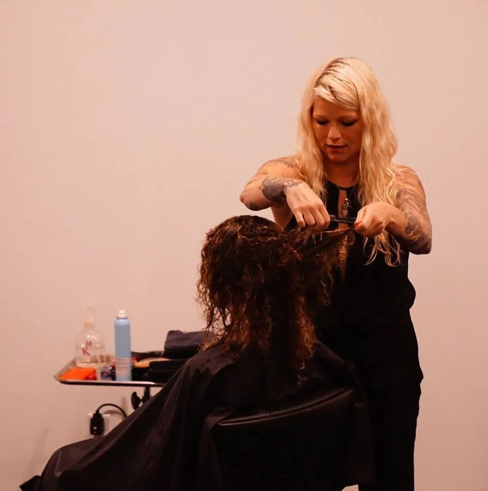 Amanda Jenkins gets her hands in the curls. 