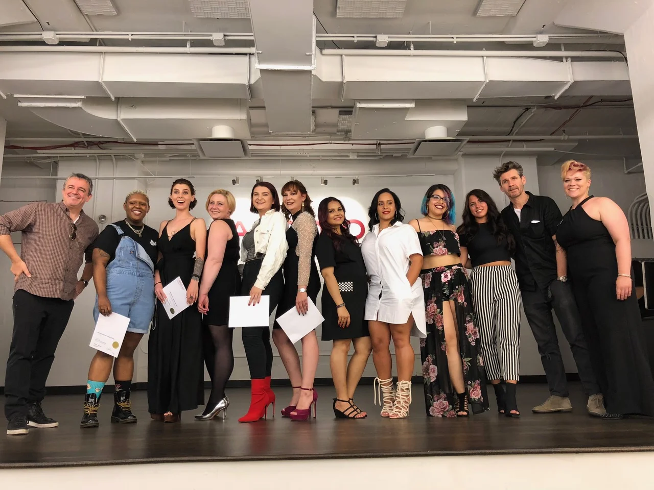 Graduates & Models On Stage With Nick Arrojo (school owner) & Paul Merritt (guest educator) 