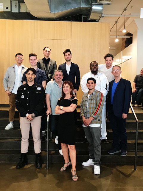 Graduates celebrate their transition from students to stylists with school faculty