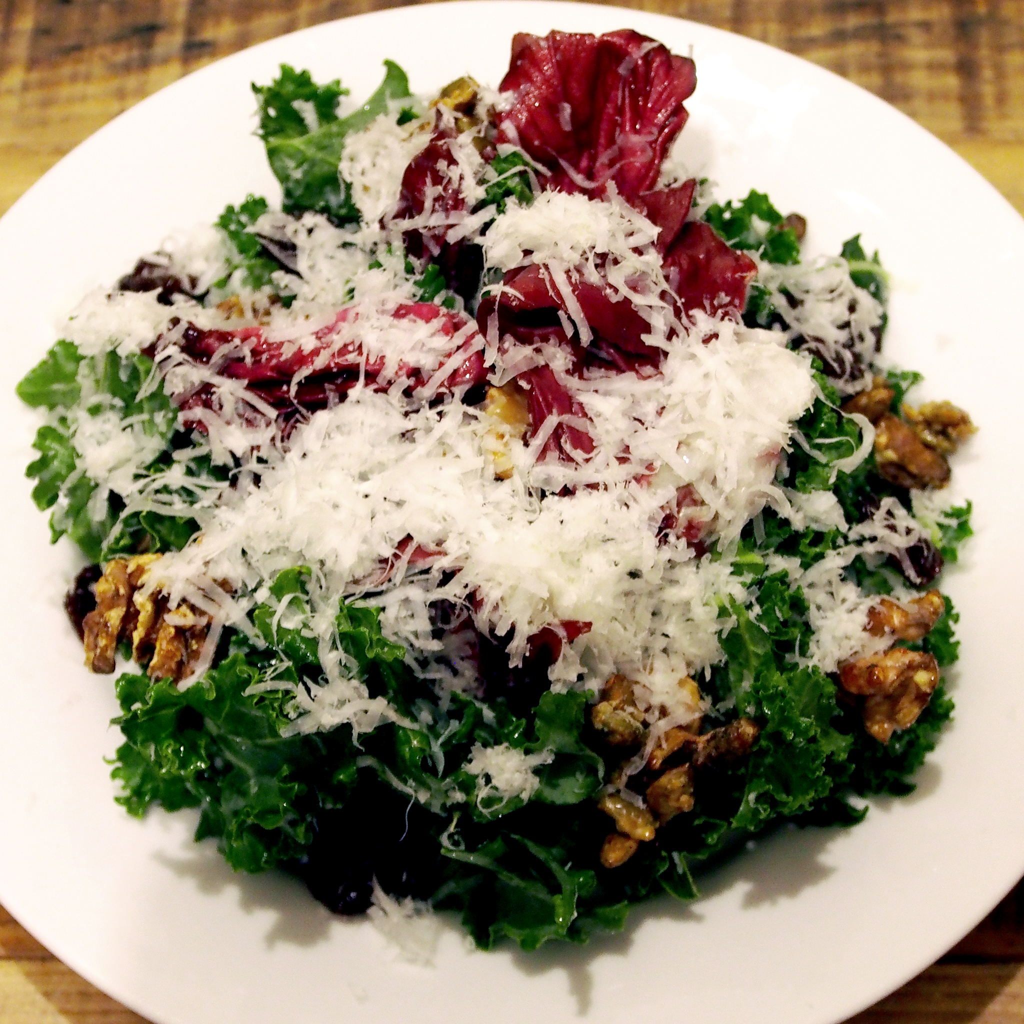 Cherry, kale & walnut salad with radicchio, Pecorino cheese and pumpkin seeds. Yum!