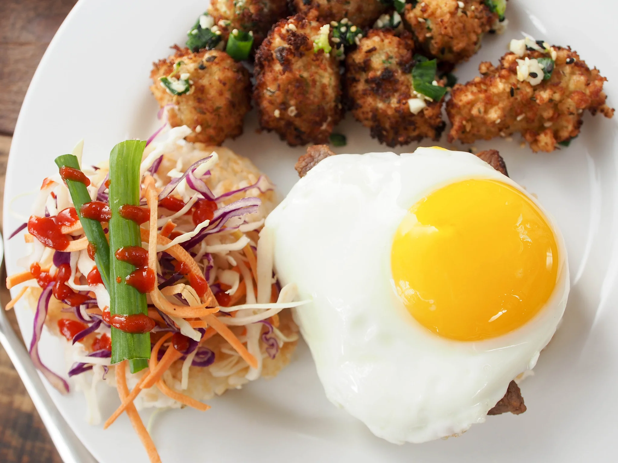 Close-up of the fried sesame broccoli and a top view of the burger. Look at that perfect sunny side up egg!