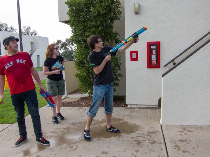 Me and Patrick (with Eliza Tiernan in the middle) battling to the death in a water gun fight against Robert Crais & Kim Stanley Robinson