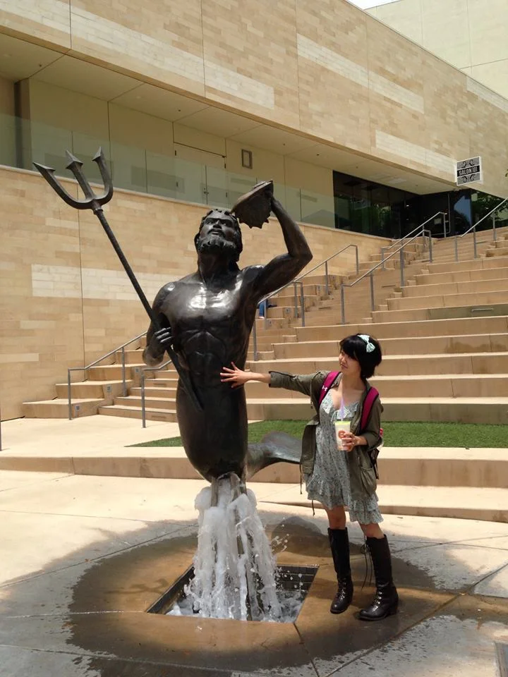 And lest I've frightened you too much, here's Alyssa posing with the UCSD Triton. She's get a weird thing for mer-people — but hey, I don't judge.