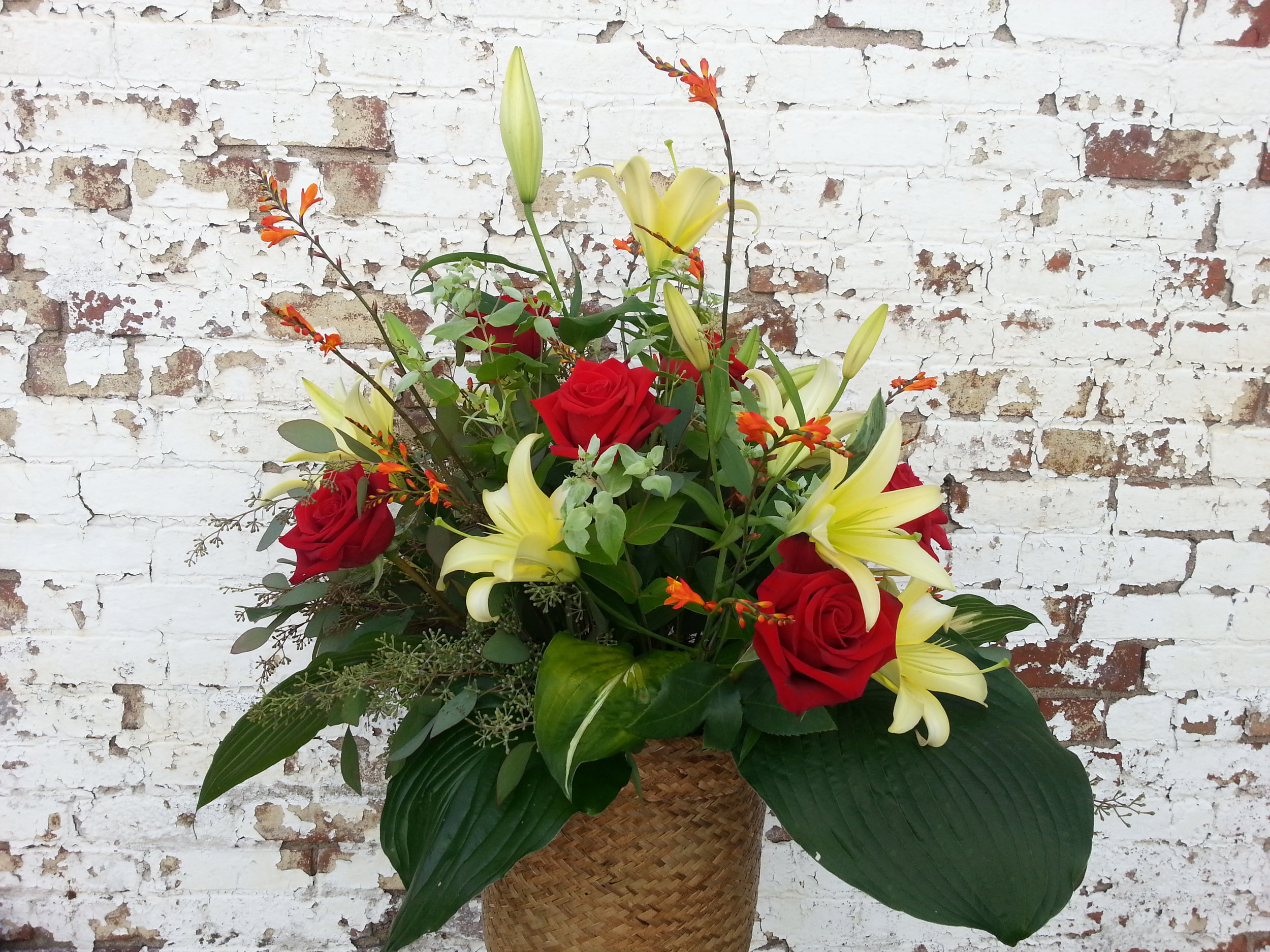 $150 Soft Yellow Lily and Red Rose Basket