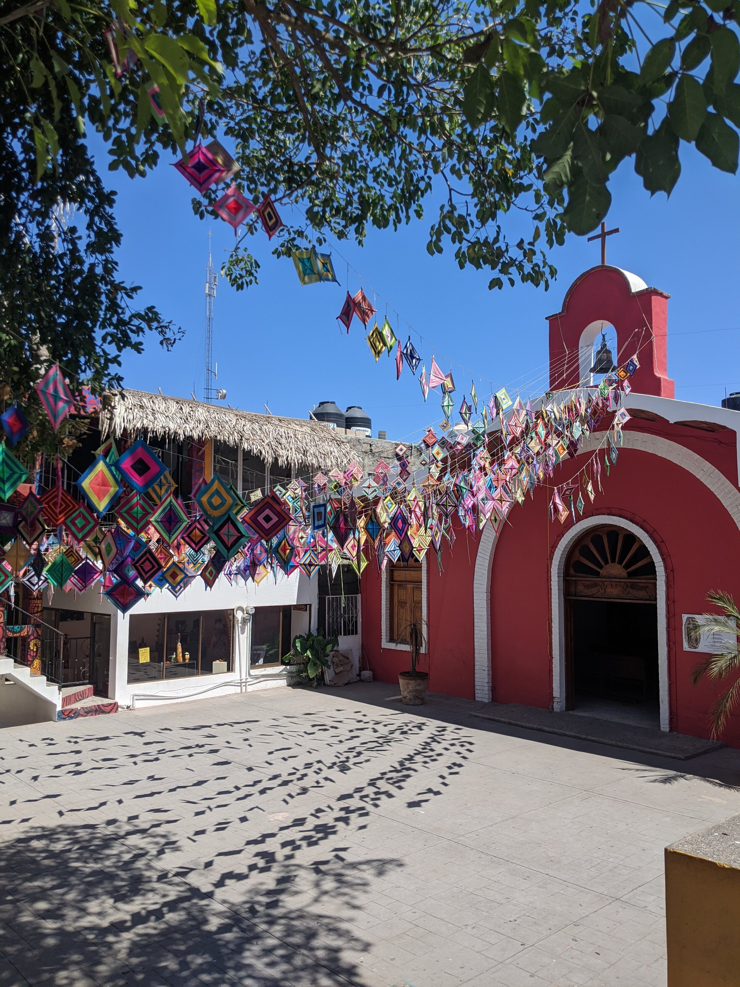 Catholic church with Ojos de Dios banners