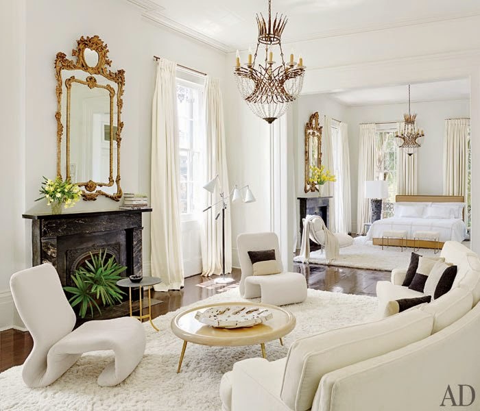 white+bedroom+wiht+black+marble+fireplace+and+gilded+ornate+mirror.jpg