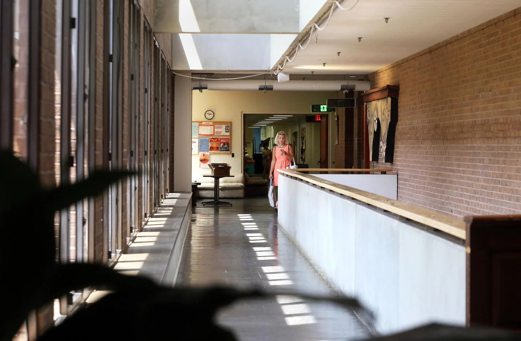 A woman makes her way down the second floor hallway of the College of Charleston’s Albert Simons Center for the Arts on Monday, August 12, 2019. Brad Nettles/Staff - Brad Nettles bnettles@postandcourier.com
