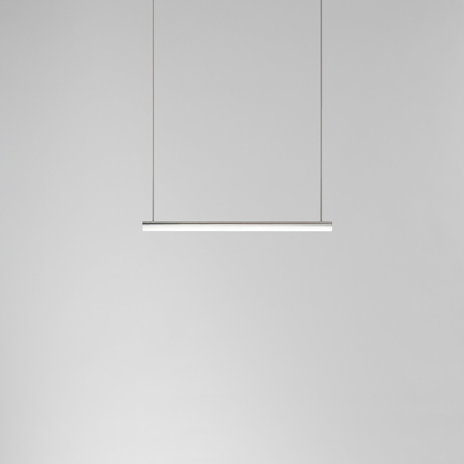 minimal modern metal tube light pendant by Michael Anastassiades