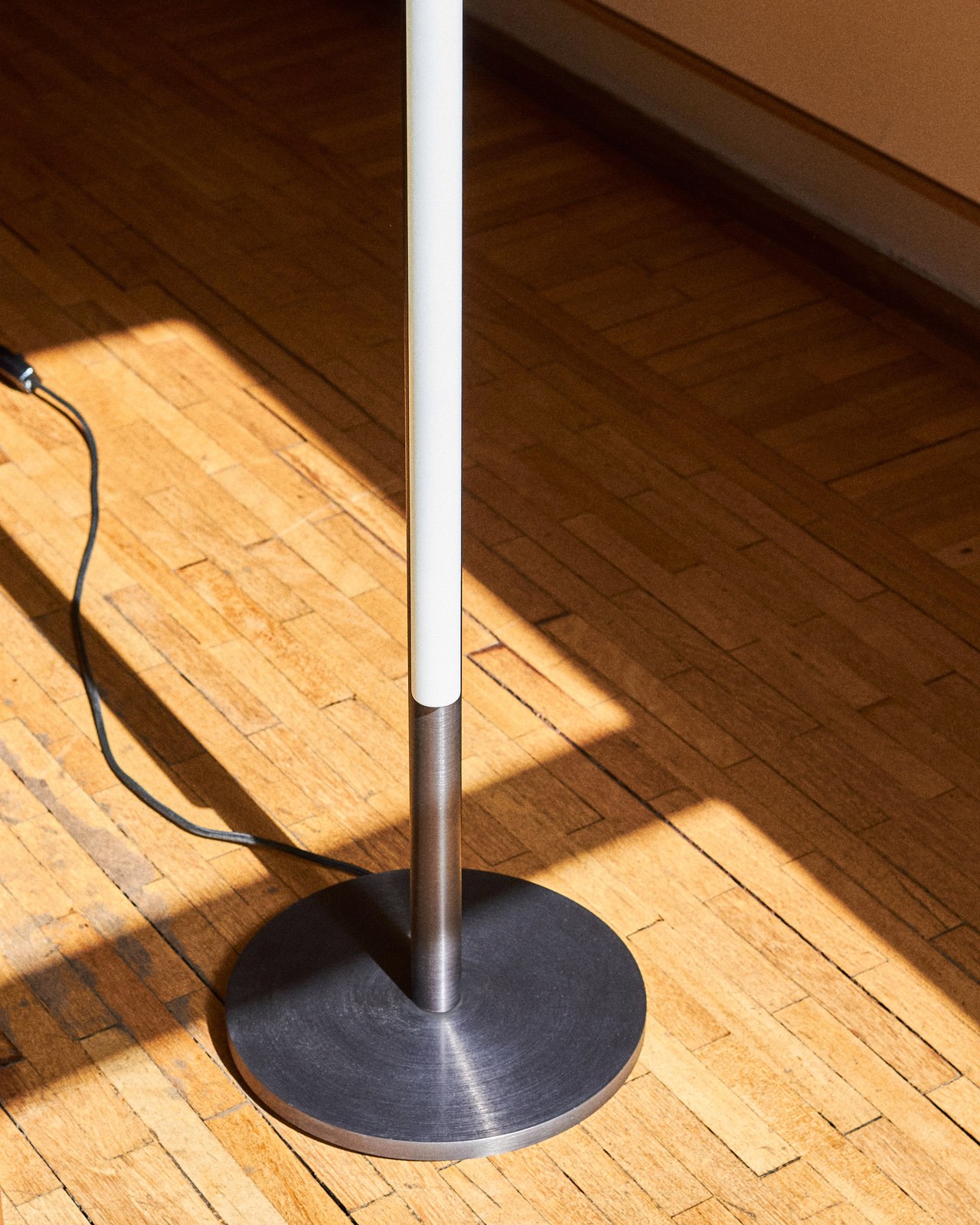 aluminum metal minimal modern tube floor lamp by Michael Anastassiades