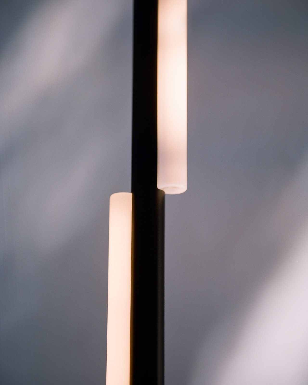 modern metal pendant tube light by Michael Anastassiades