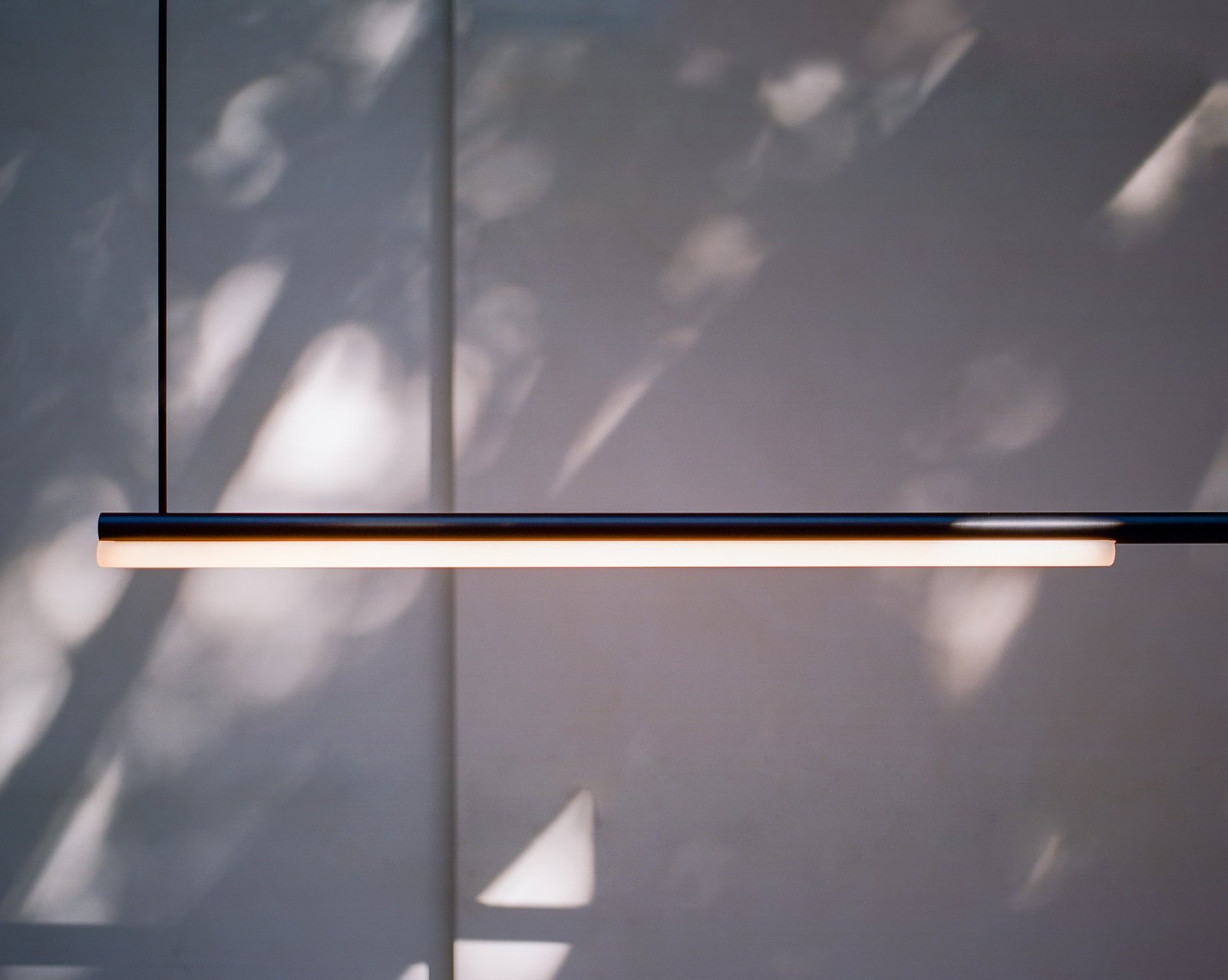 aluminum metal minimalist modern tube light pendant by Michael Anastassiades