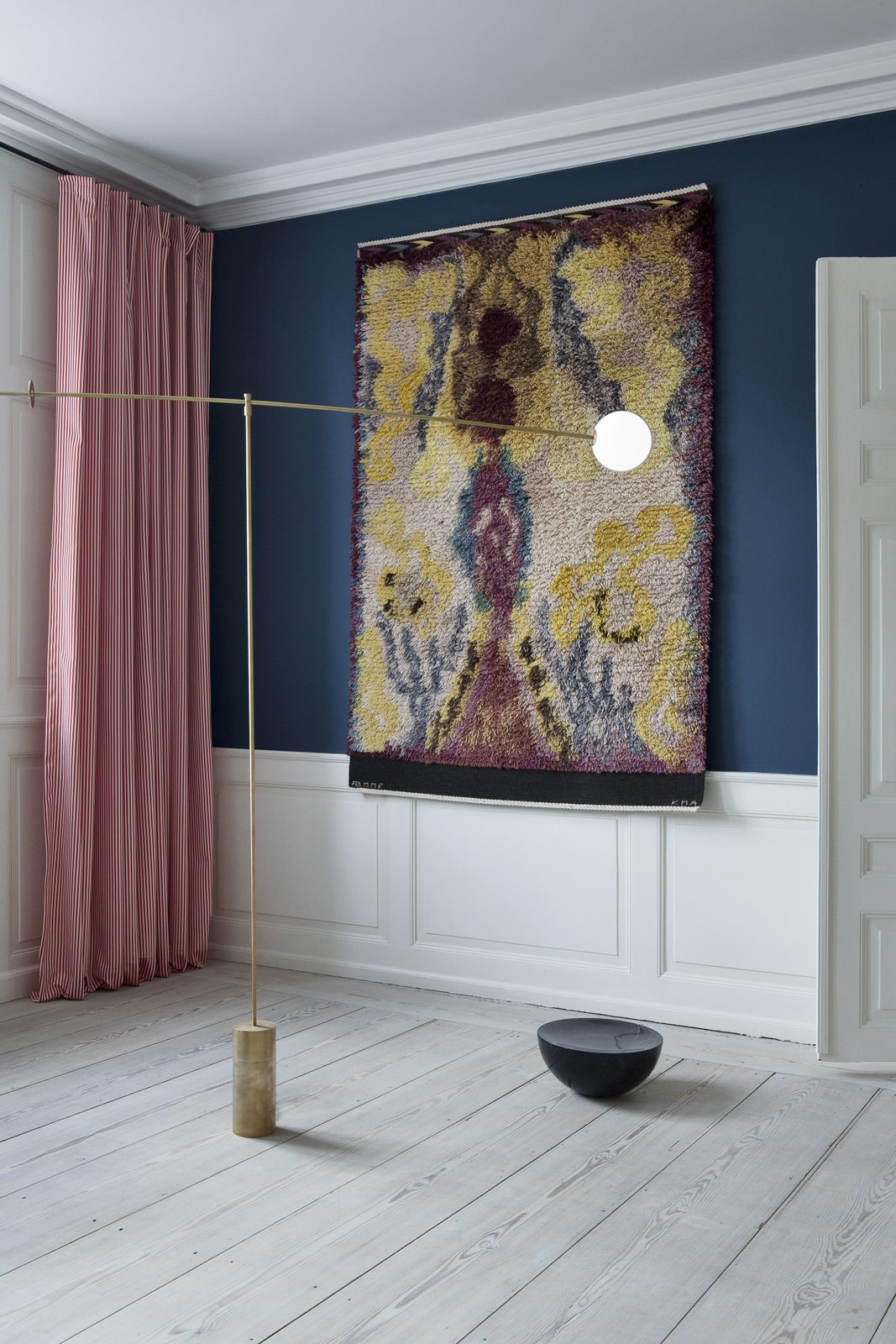 modern mobile floor lamp in brass by michael anastassiades