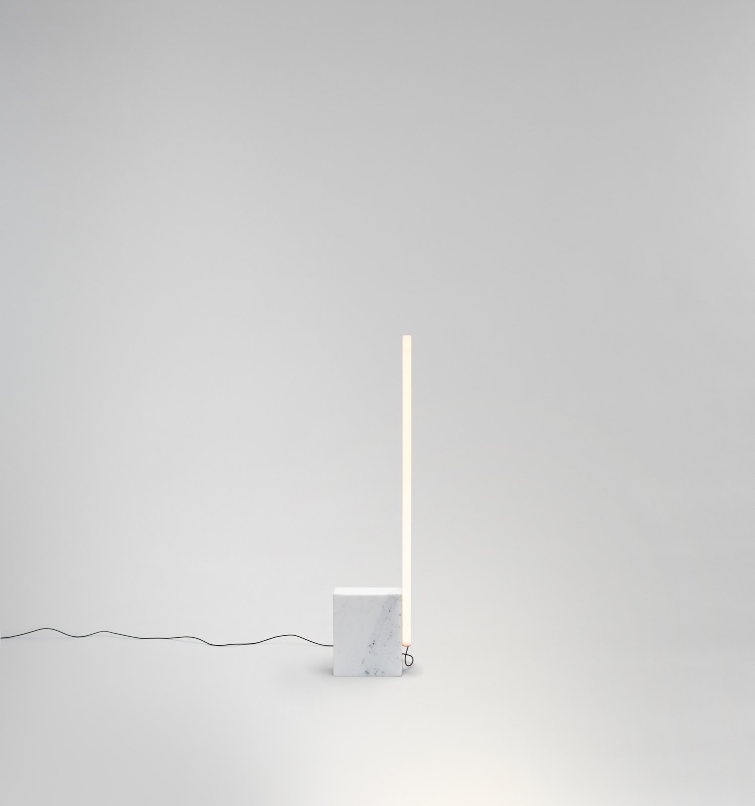 modern minimal tube floor lamp in marble by Michael Anastassiades