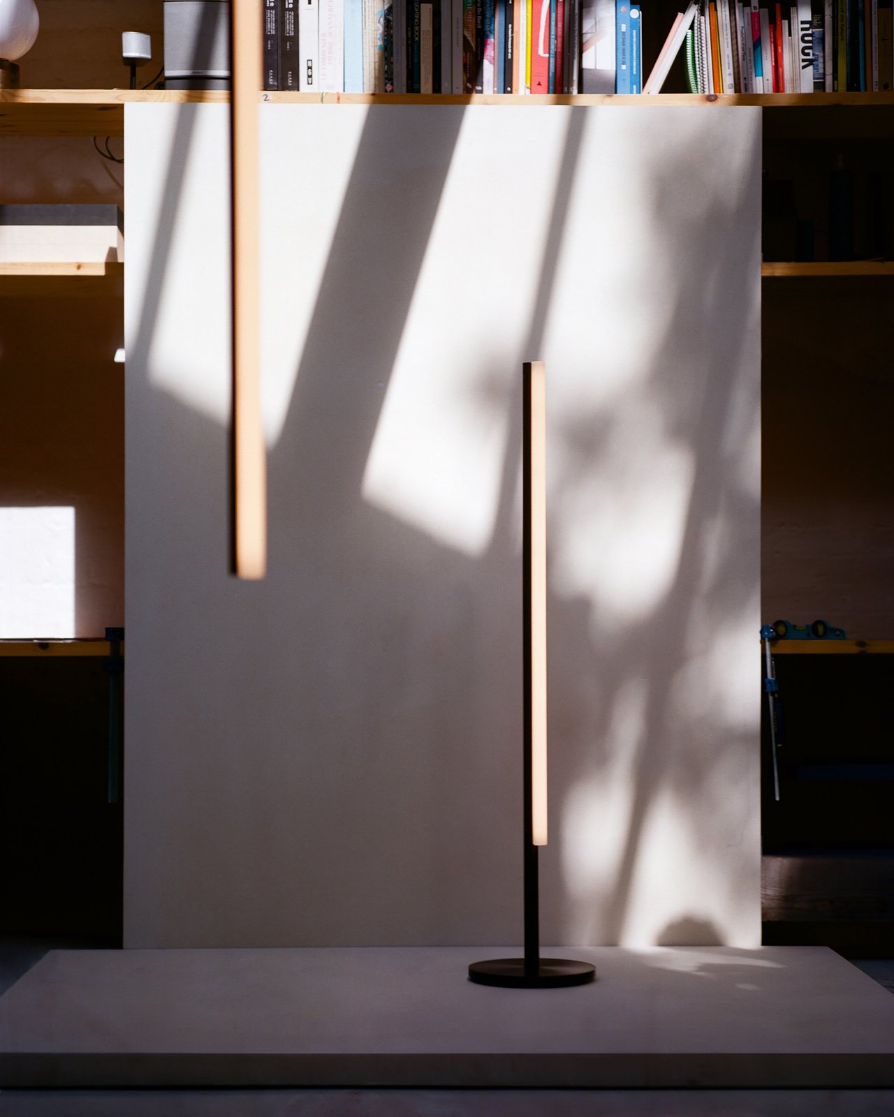 aluminum metal minimal modern tube floor lamp by Michael Anastassiades
