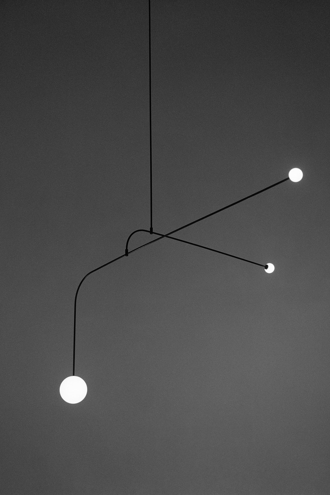 modern mobile chandelier pendant in brass by michael anastassiades