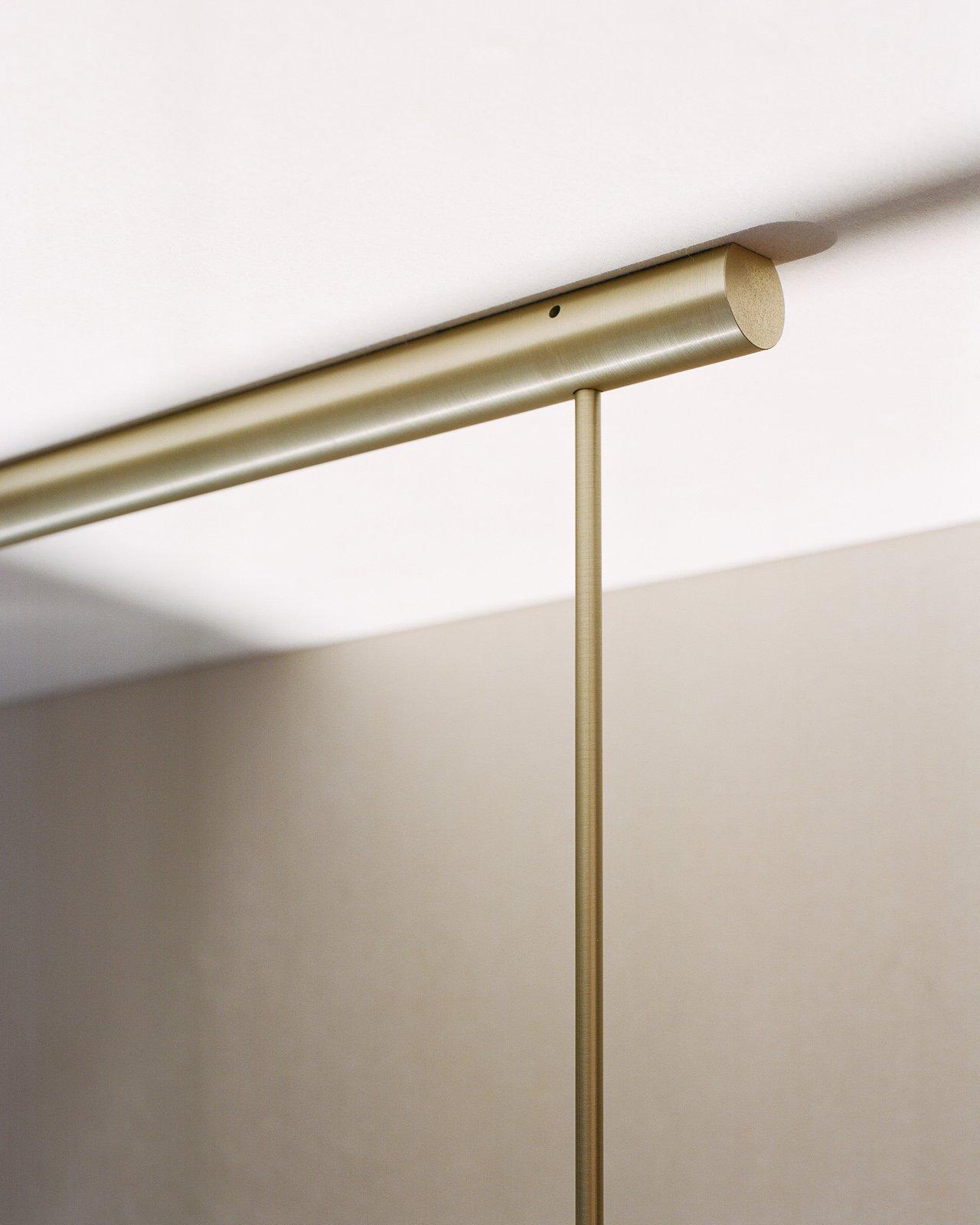 minimal modern metal tube light pendant by Michael Anastassiades