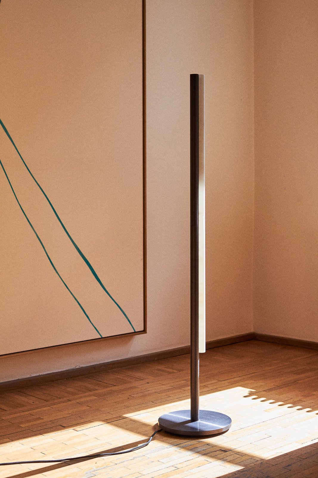 aluminum metal minimal modern tube floor lamp by Michael Anastassiades