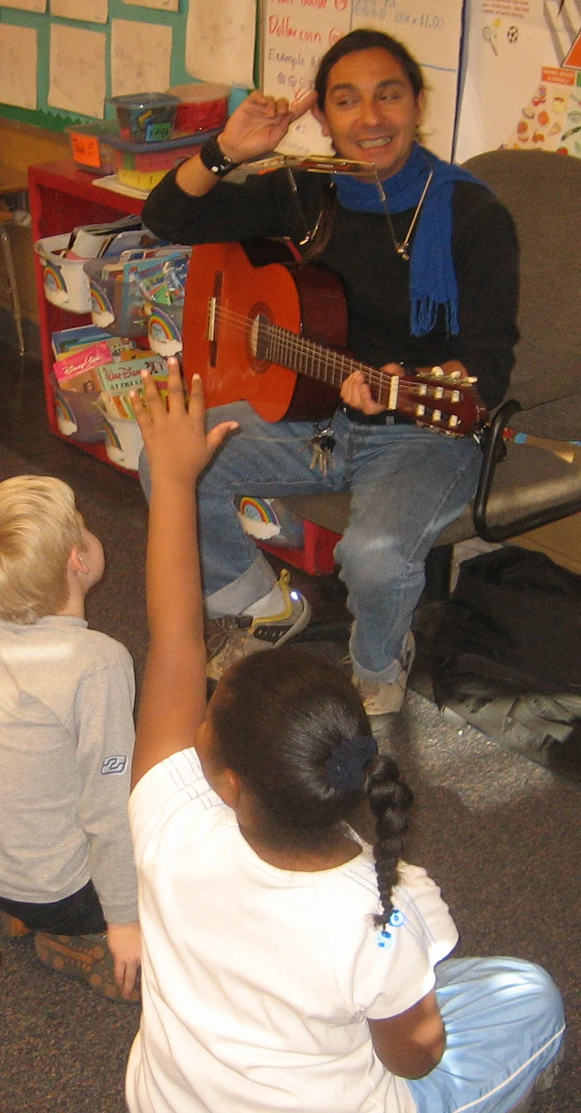 Felix with harmonica and guitar