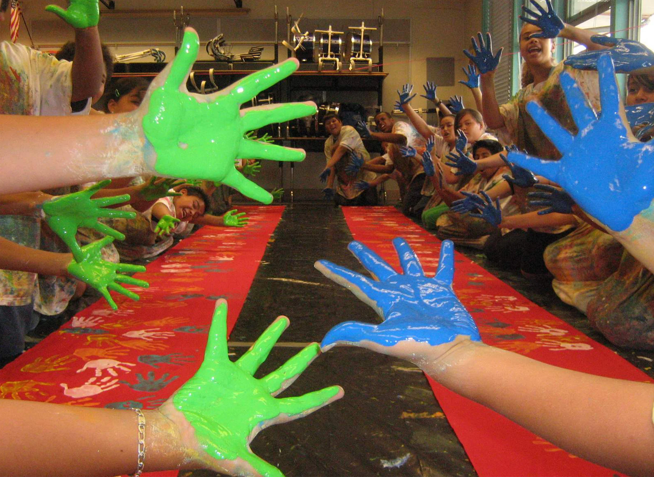 Monroe Clark students painting giant puppets