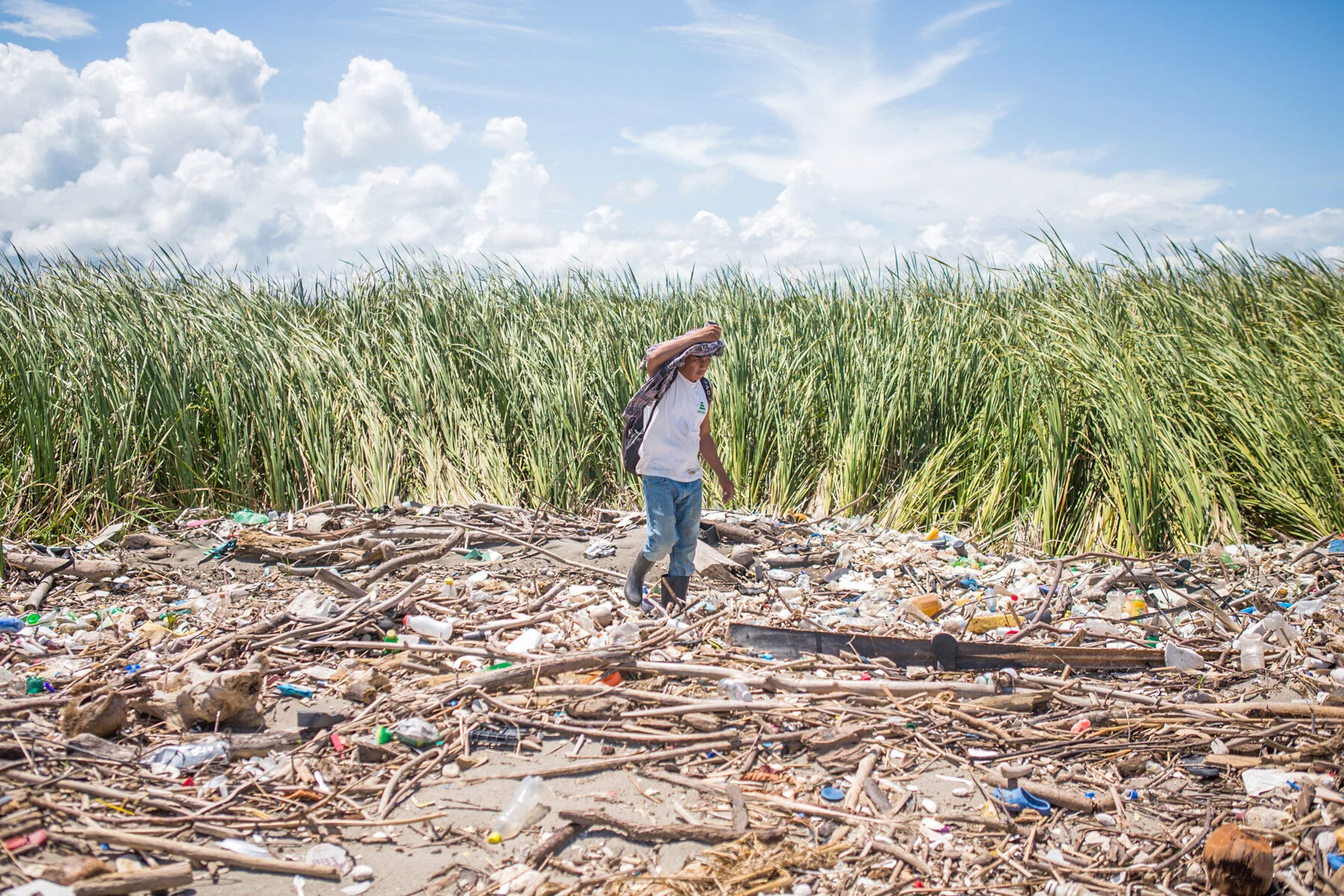  El Quetzalito, Guatemala //  “As I step onto shore, I notice more bits of plastic lying among the reeds, half-buried in the mud, as well as stained scraps of cloth, bits of packing foam, a single cracked plastic sandal. Just beyond, Guatemala’s Mota