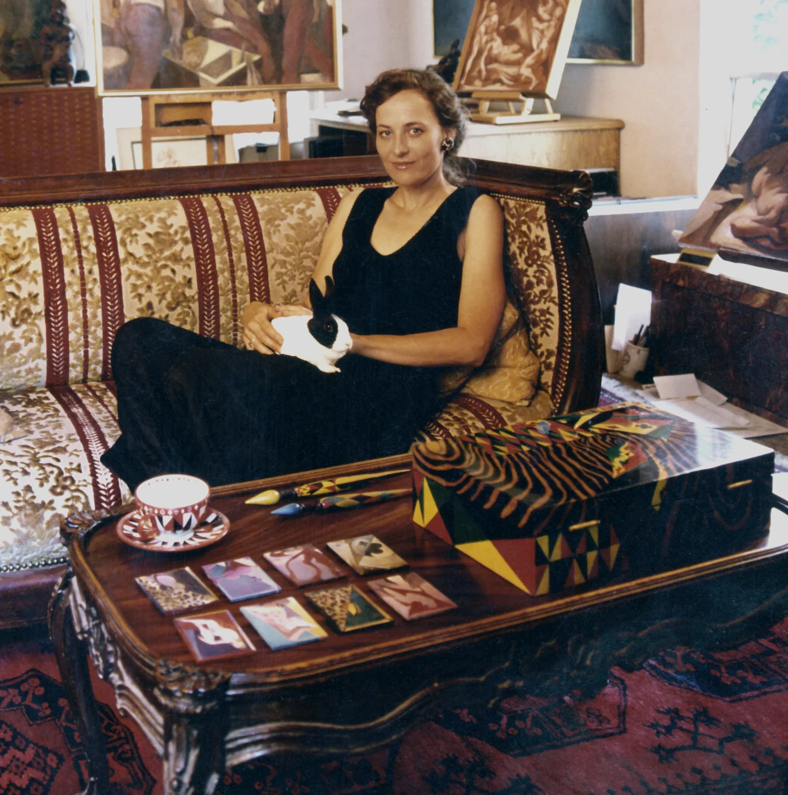 Miriam Slater is a California based artist who works in a variety of art styles including cubism, surrealism, classicism and expressionism. She is a painter in the traditional sense but also paints on a variety of objects such as musical instruments, boxes, teacups, jewelry and furniture. She attended California State University Fullerton and received a BFA in painting with a minor in art history (1975). Upon graduating she went on to exhibit in Los Angeles and soon developed a celebrity cliental including Jack Nicholson, Anjelica Huston, Quincy Jones, Jeff Bridges and Brooke Astor. She also studied faux marbling, gilding and antique Japanese lacquer techniques and so has created murals, furniture and fanciful interiors. Designers she has worked for include Sister Parish, Mark Hampton, Jarrett Hedborg and Nancy Pierrepont. In 1978 she attended Art Center College of Design and studied drawing and painting with figurative artist Harry Carmean. In 2003 she obtained a Masters Degree in Traditional Oriental Medicine and is a licensed acupuncturist. Slater currently lives in Santa Barbara, California where she paints and works with number of environmental organizations.